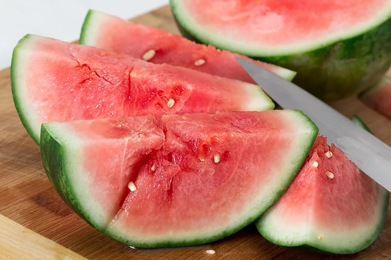 Fresh red watermelon slices and cubes.